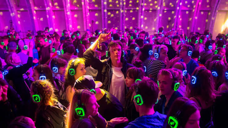 Indoor packed silent disco with LED headphones